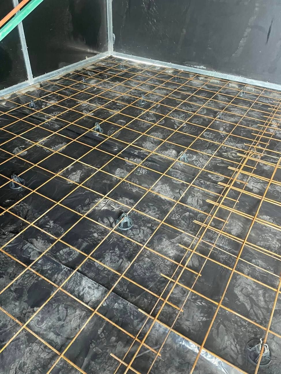 Reinforcing mesh set on chairs before a pour